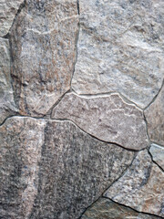 Textured wall panels designed to mimic the look of natural stone for interior or exterior use in modern spaces