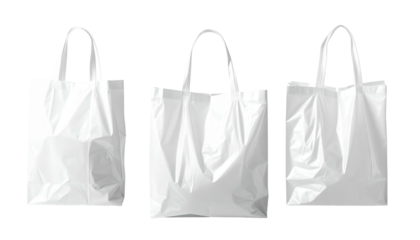 Three white plastic shopping bags in a row against a black background, angled slightly differently