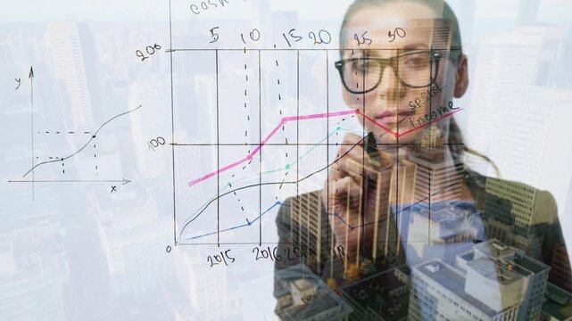 Double exposure of a business woman draws various growth charts