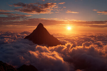 Fototapeta premium A mountain peak rises through glowing clouds at sunrise, symbolizing triumph, elevation, and the ultimate height of achievement.