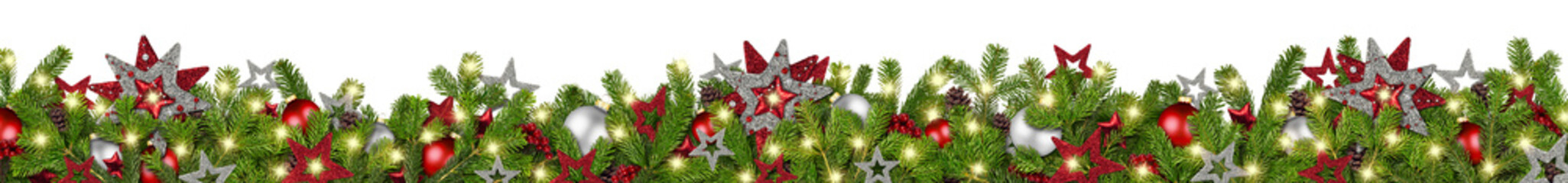 christmas garland super wide panorama banner with fir branches red silver stars lights and baubles xmas russtic traditional natural tree decoration isolated white background	