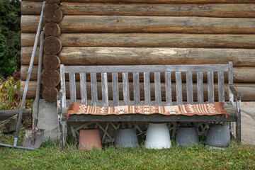 An old wooden bench near a village house