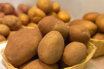 fFesh potatoes on a farmer's market stand