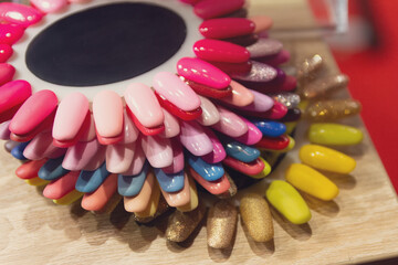 Vibrant array of nail polish shades displayed on a color wheel for manicure inspiration