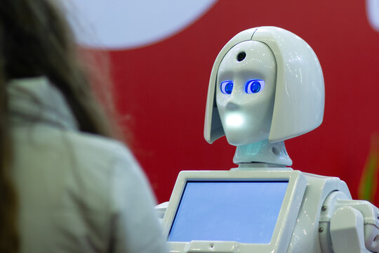 Girl communicates with the robot