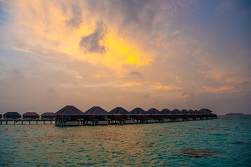 Beautiful sunset. Summer vacation, holiday amazing nature. Relax paradise, Maldives. Tropical island beach landscape exotic shore coast. Tranquil closeup calm sea water waves with palm trees. 