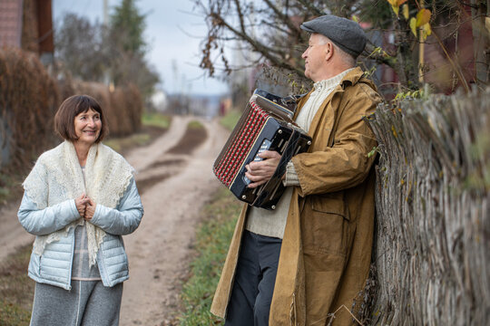 The accordionist is the best guy in the village.