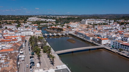 Fototapeta premium Aerial, Tavira, Portugal Scenic Tavira views, Beautiful river landscapes in Tavira, Breathtaking riverside scenery around Tavira town, Picturesque river vistas