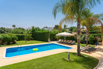 Family pool enjoyment, Enjoyable outdoor setting with pools and recreational zones for families, Vibrant and sunny outdoor environment designed for family fun and water