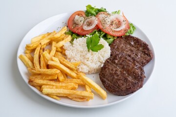 Beef patties rice fries salad, seared double patties with charred crust, steamed rice and crispy fries, sliced tomatoes and onions, hearty dinerstyle meal for game day