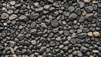 overhead close-up texture of dark grey and black gravel with lighter speckled stones.