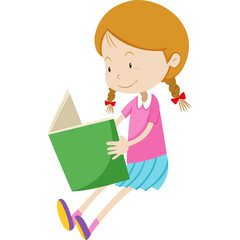 Young girl with auburn hair in braids wearing a pink shirt and blue skirt sitting and reading a green book with a bright expression on her face