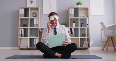 Multitasker man with sticky notes stuck on the face busy to perform, manage many tasks sitting cross-legged in easy yoga pose at workplace, overworked, meditating on break time to relax, breathing  - Powered by Adobe