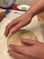 woman hands kneading dough