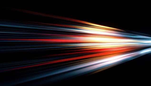 Abstract streaks of bright red blue and yellow light against black.