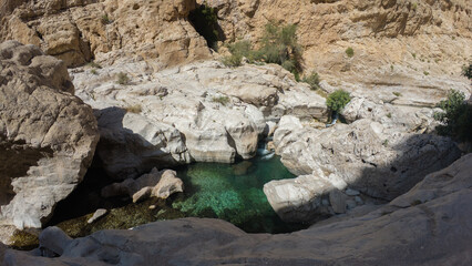 Wadi Bani Khalid is a popular Omani oasis featuring large, swimmable emerald-green pools and canyon landscapes in Oman.