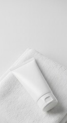 Fototapeta premium White Cosmetic Tube Mockup on Fluffy Towel Minimalist Skincare Template