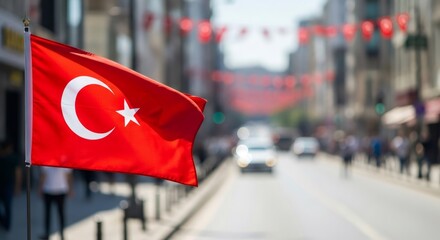 Turkish flag waving proudly on a city street, representing national pride and patriotism for Independence Day celebration