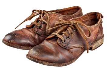 Pair of old worn leather lace up shoes with frayed laces