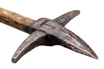 Close up of an ancient metal pickaxe head with a wooden handle