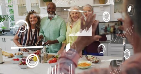 Man raising phone capturing group cooking and stirring pan while AR HUD tracking graphs for sharing