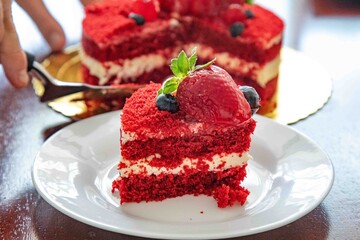 Delicious and beautiful red velvet cake with red berries.