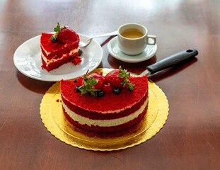 Delicious and beautiful red velvet cake with red berries.