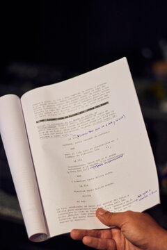 View of a film script in an audiovisual production, with a close-up of its words, corrections, highlighting, reading, etc. to record a scene