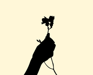 Silhouette of holding a wild flower on hand concept design. Icon of people arm gesture grab a plant. Vector illustration