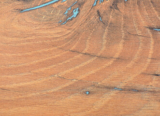 Cherry, aged natural wood texture with blue artificial veins, close-up.