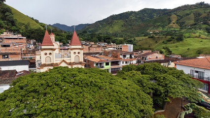 Obraz premium Hispania, Antioquia - Colombia. October 8, 2025. Panoramic drone view of the town's main church.
