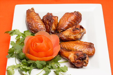Barbecue Glazed Chicken Wings with Tomato Garnish