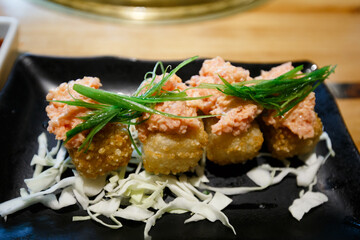 Fried Sushi Rolls Topped with Spicy Salmon Tartare and Chives