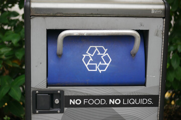 Outdoor recycling bin with usage instructions