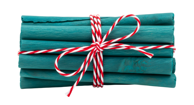 Gift - Bundle of cinnamon sticks tied with red and white striped string on white background, perfect for holiday cooking and decoration