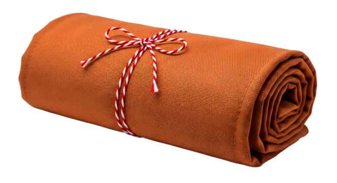 Gift - Rolled orange blanket tied with red and white striped string, cozy home accessory perfect for autumn and winter