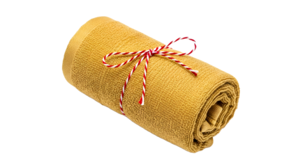 Gift - Rolled yellow towel tied with red and white striped string on black background, perfect for spa and home decor
