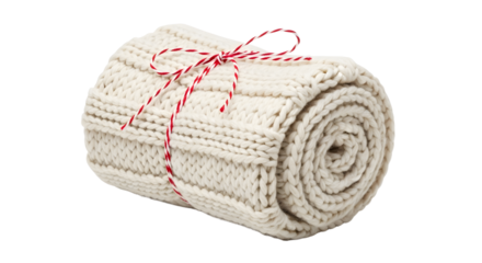 Gift - Rolled cream knitted blanket tied with red and white string isolated on white background, cozy gift idea