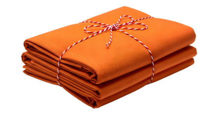 Gift - Stack of neatly folded orange fabric tied with red and white string on white background, perfect for textile projects and crafts
