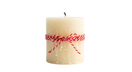 Gift - White pillar candle with red and white twine bow tied around it, isolated on white background, perfect for holiday and cozy decor