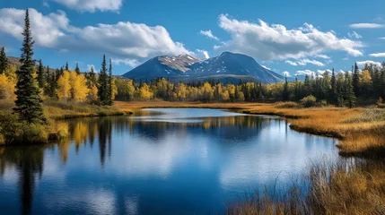Tableau sur plexiglas Réflexion A serene mountain lake with vibrant fall foliage reflected in the calm waters.  © Crafted