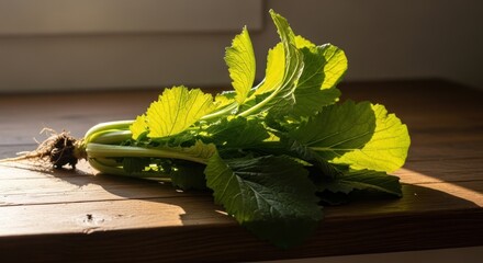 Fresh Mustard Greens on Wooden Surface Illuminated by Sunlight Streaming through a Window