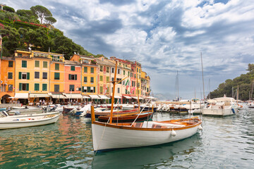 Colorful harbor with traditional boats and buildings in Portofino, Italy, Liguria region