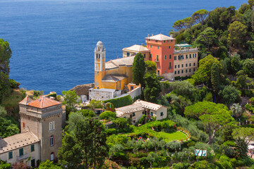 View of church and historic villas on the coast of Portofino, Italy, Liguria region