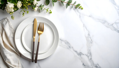 Elegant table setting with gold utensils and white plate
