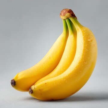 Three Ripe Bananas with Water Drops