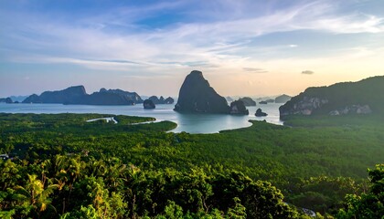A stunning aerial view showcases a vibrant green forest at the foreground. The scenery features islands and a calm body of water