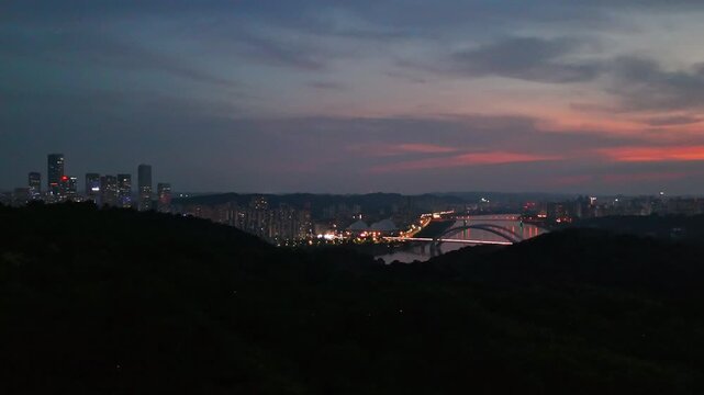 Panoramic Nightscape Featuring the Glowing Nanning Bridge in Urban Guangxi, China