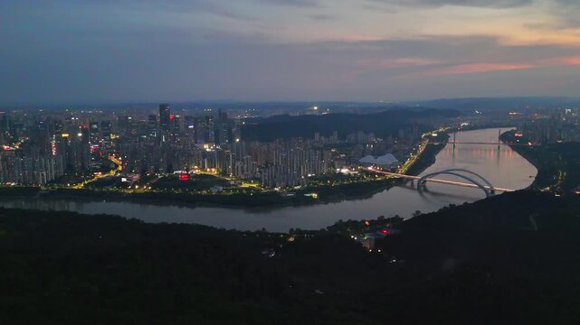 A Symphony of Light and Structure: Night Aerial View of Nanning's Landmark Bridge