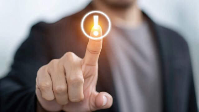 A person touches a glowing notification icon with their finger, symbolizing interaction with technology or digital alerts.